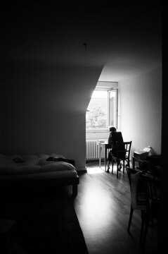 A film portrait of young beautiful woman lying on her working place