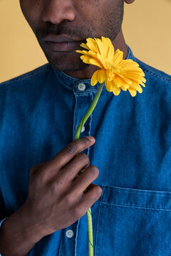 Handsome Black Man Holding Flower