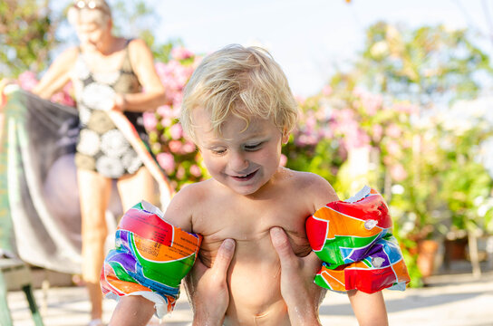 Father and Son Playing in the Pool