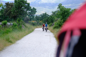 Obraz premium mother and son cycling in the countryside
