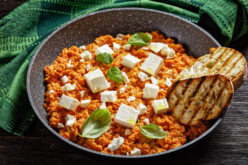 eggs scrambled with tomatoes and feta cheese