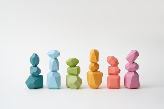 Stacks of balanced wooden pieces in row