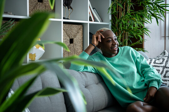 Young African Woman Watching TV.