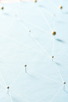 Set of intertwined pins on paper