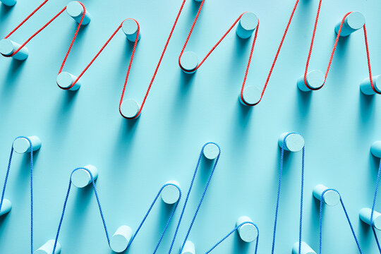 Pegs connected with colorful threads