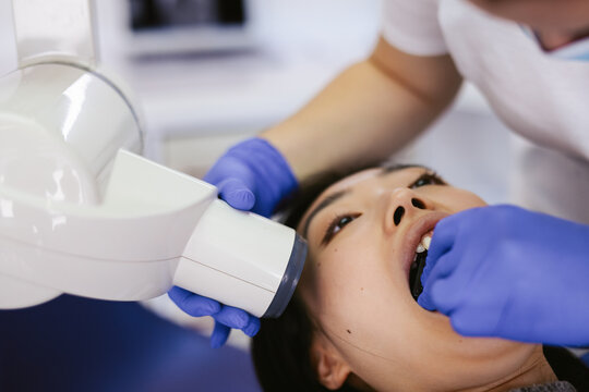 Dentist making x ray scan of jaw 