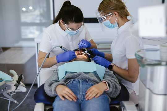 Woman caring about mandibular teeth 