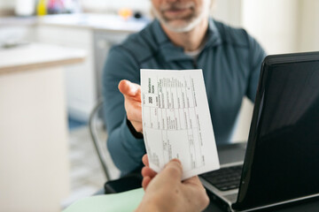 Taxes: Woman Hands 1099 Income Form To Husband