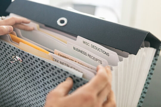 Taxes: Woman Going Through Business Receipts Section