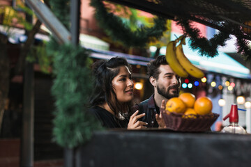 Couple at healthy smoothie stand 