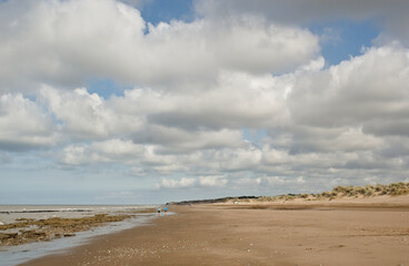 man walking in a beach