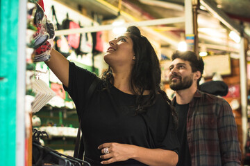 Latina woman shopping on a souvenir shop