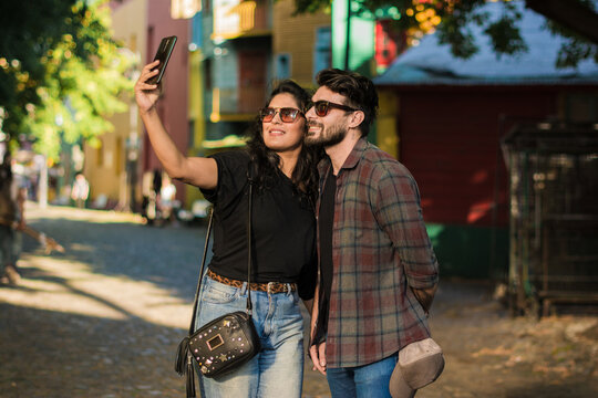 Couple taking a selfie in touristy spot 