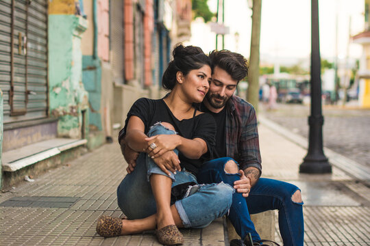 Adorable romantic moment of a couple in the street