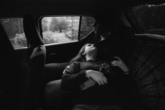 Teen couple in a car