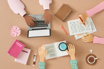 Small team of young UX designers creating mobile app layout