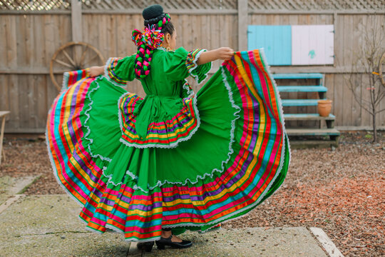 Portrait of a Mexican-American tween wearing a traditional Mexican dress