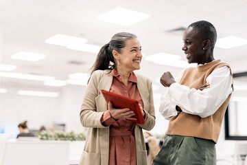 Multicultural Coworkers Chatting in Office
