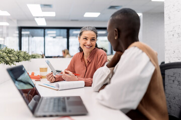 Multicultural Coworkers Chatting in Office