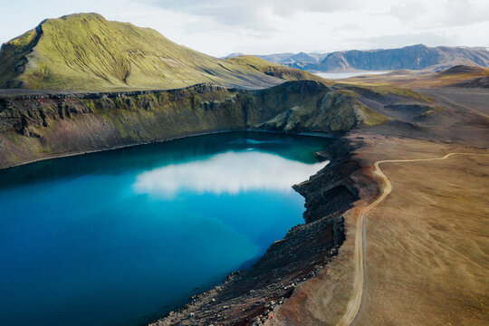Drone / Aerial view of the stunning blue crater lakes of Bl&aacute;hlyur and Lj&oacute;tipollur in the Icelandic Highlands.