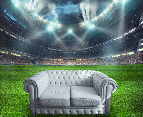 White sofa at the center of the soccer field
