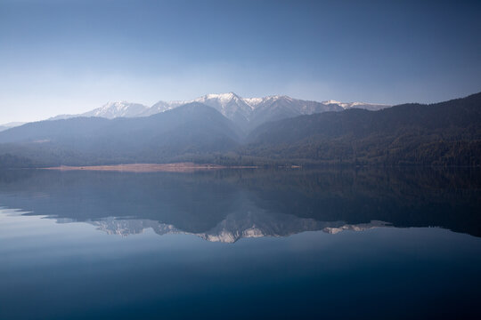 Reflection of the surrounding mountains in Rara Lake, Nepal.