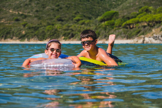 Siblings Having Fun in the Sea