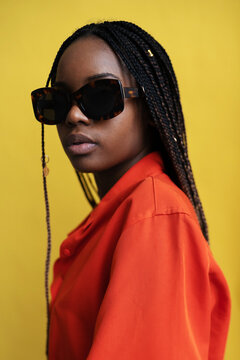 Stylish Black Woman In Sunglasses In Studio