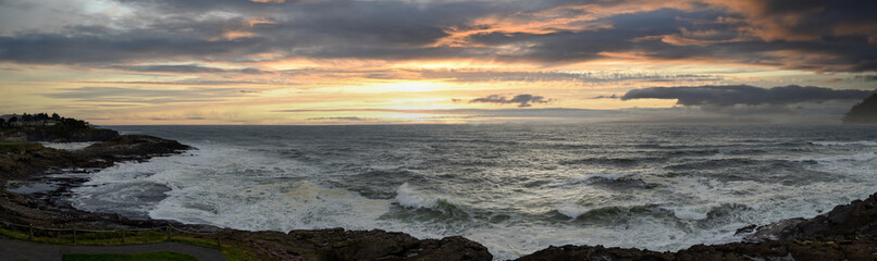 A panorama view of the Oregon coastline at sunset near Depoe Bay.