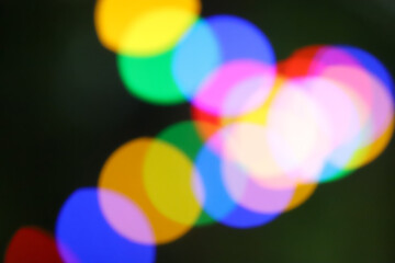 String of blurred multicolored holiday lights