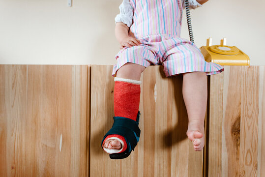 Close up of a toddler with a cast
