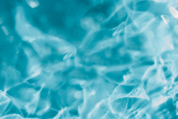 Close up macro Aloe vera gel cosmetic texture blue background with bubbles.