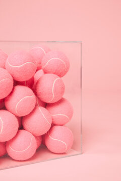 A box full of pink tennis balls