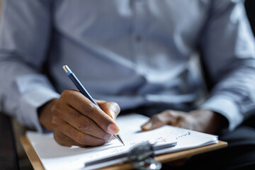 Male writing information about himself 