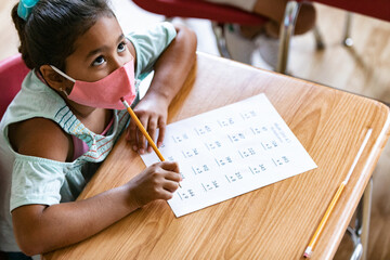 School: Girl Student With Face Mask Looks Up While Thinking