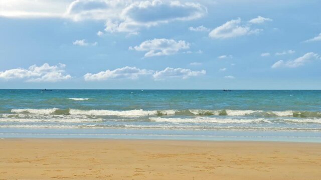 4k footage ; Rayong beach in the morning. view of sea beach with golden sand and bright blue sky in summer. Mah Pim Beach, Rayong, Thailand. On June 2021