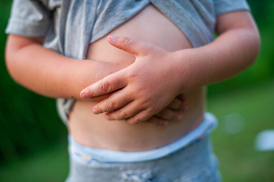 Little boy holding his belly