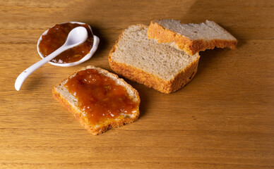 slice of homemade bread smeared with fruit jam.