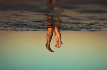 Inverted point of view of a underwater kiss