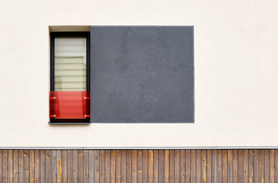 Modern residential building wall with window and colorful textur