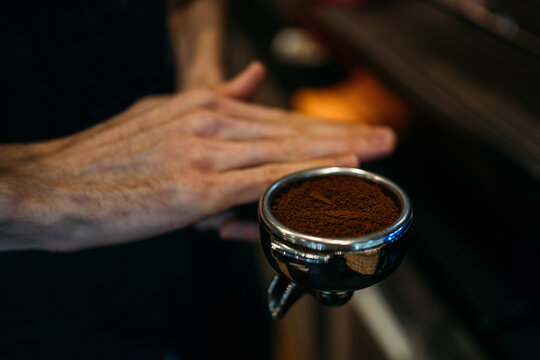 Barista prepares coffee