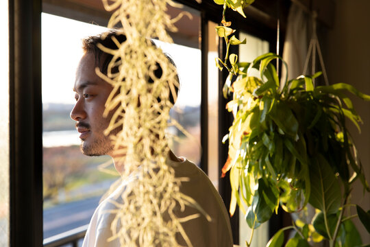 men watching out side from room at sunset time