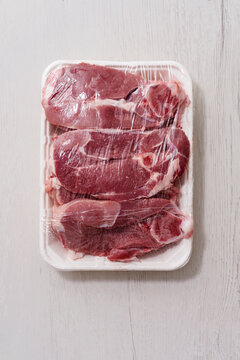 raw lamb meat in a foam tray