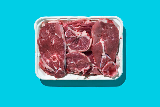 raw lamb meat cuts in a white foam tray