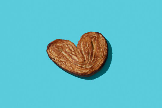 puffy pastry heart on a blue background