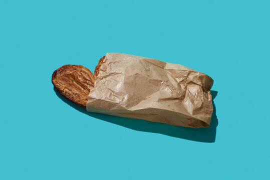 puffy pastry heart in a paper bag