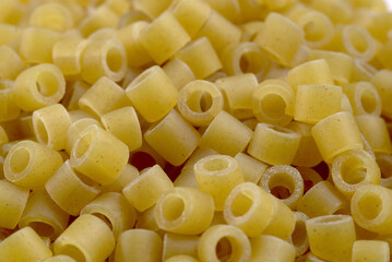 close-up of dry pasta in the form of small rings.