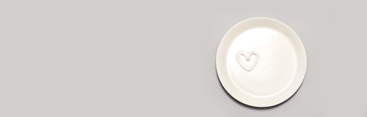 Heart shape cream. Beauty lotion. Mayonnaise smear on white plate. Top view with copyspace. White product smear. Valentine concept