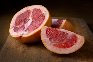 pink grapefruit fruit cut into wedges