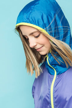 Young Teen girl wearing a windbreaker in studio
